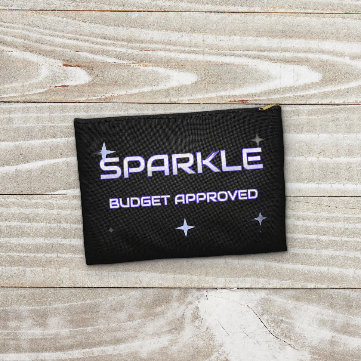 Sparkle Budget Approved black pouch on a whitewashed wood surface