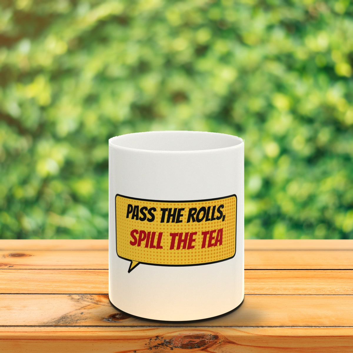 Pass the Rolls, Spill the Tea mug on a wooden table outdoors