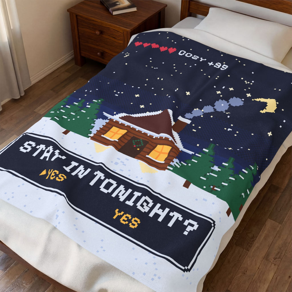 Stay In Tonight pixel art blanket on a bed