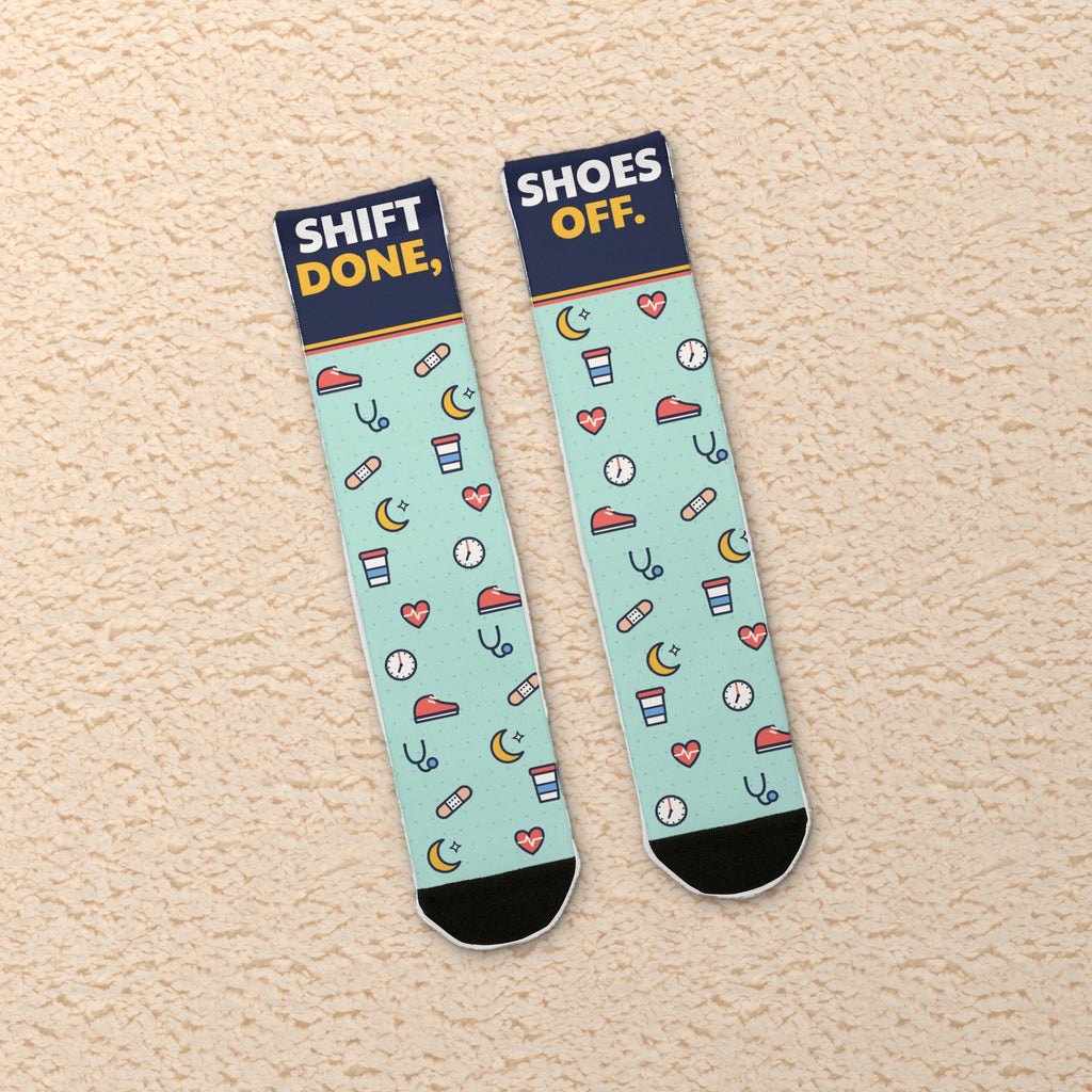 Shift Done Shoes Off nurse socks on a cozy teddy blanket