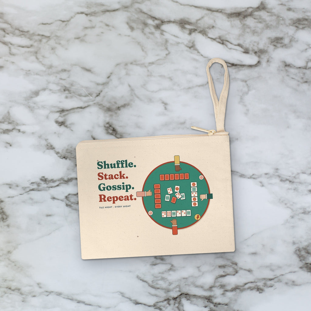 Shuffle Stack Gossip Repeat pouch styled flat lay