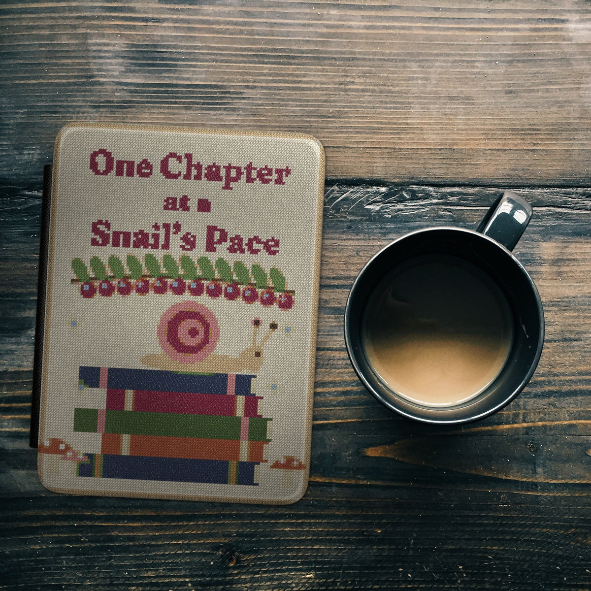 Snail's Pace e-reader case styled flat lay