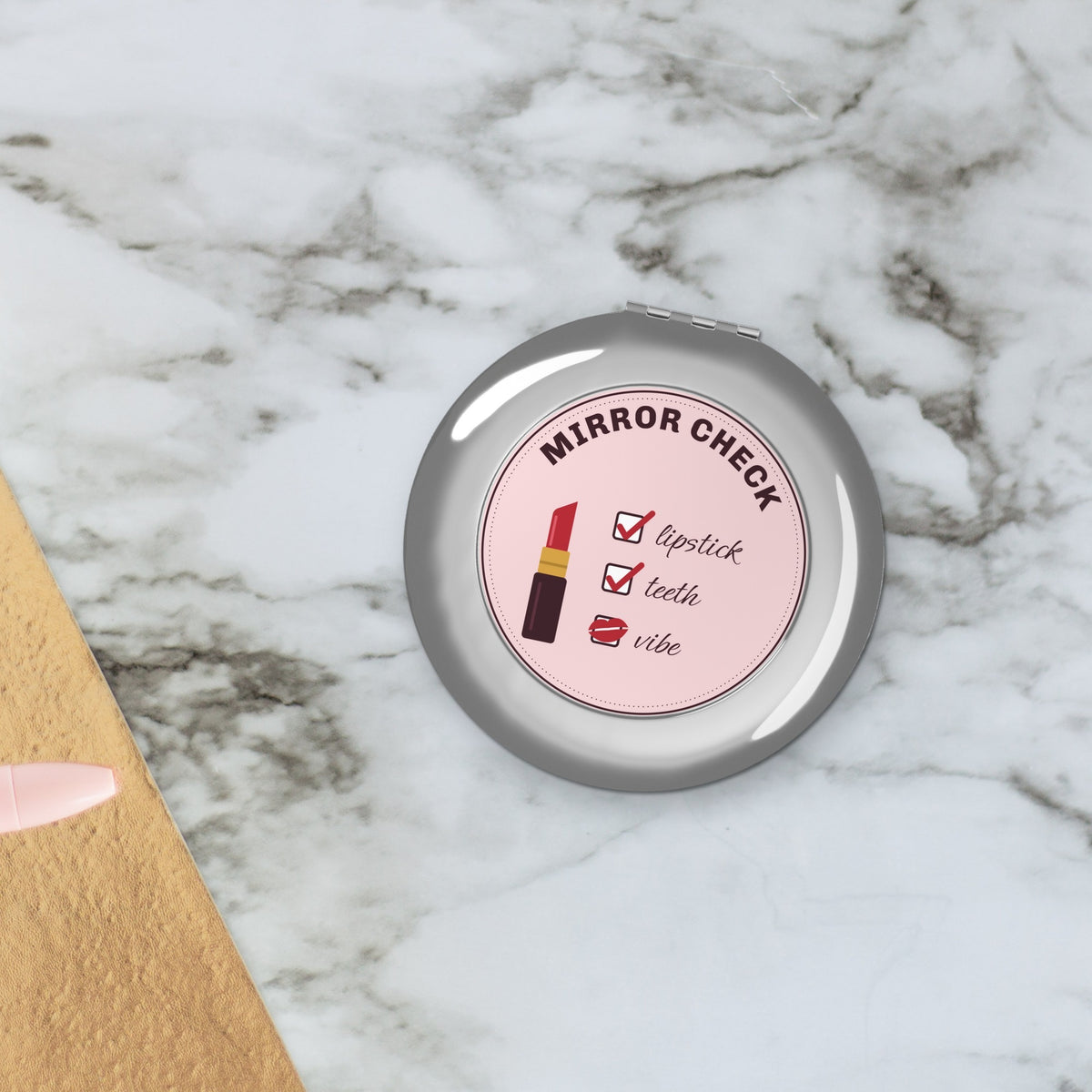 Compact mirror styled on marble